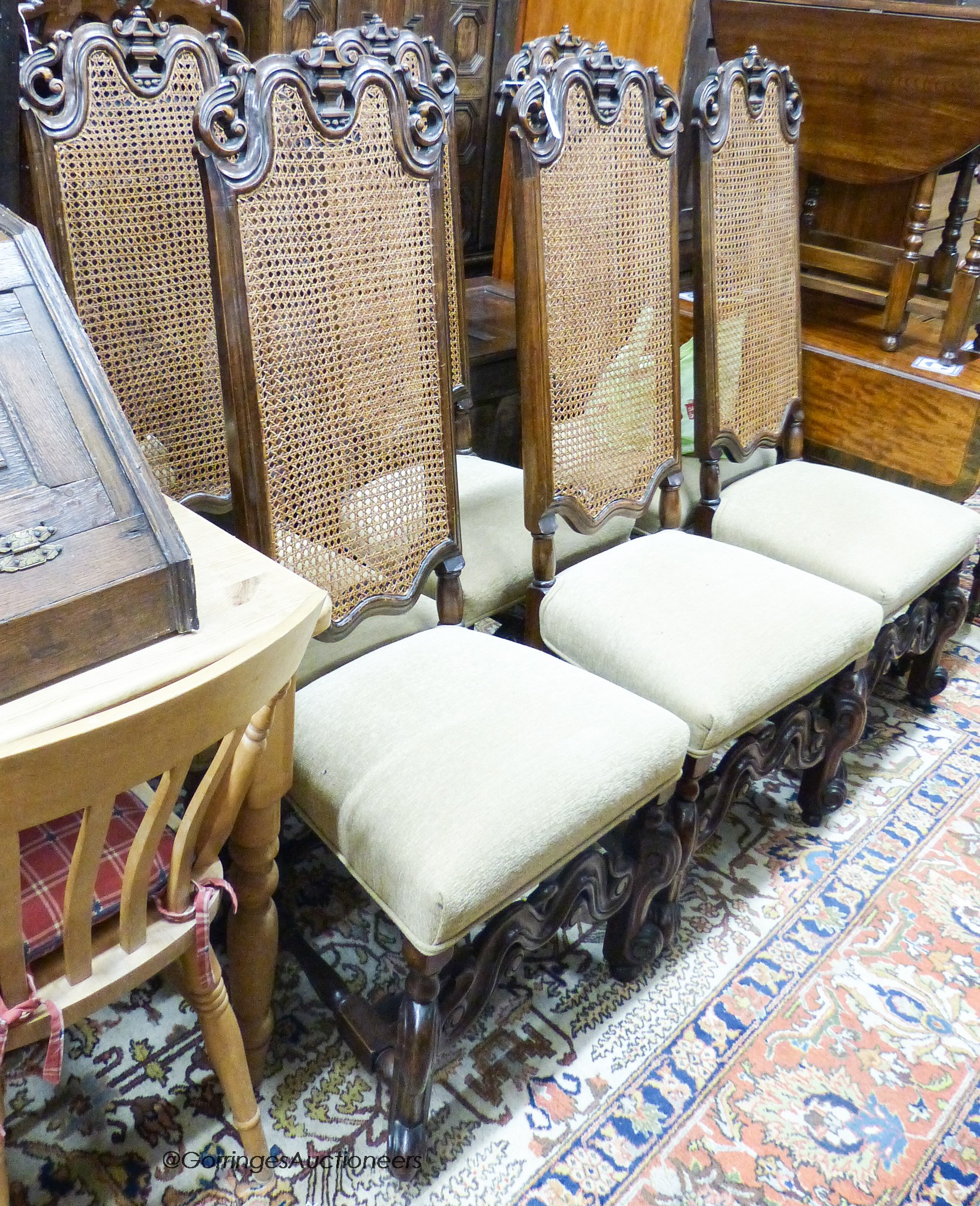 A set of eight William and Mary style walnut dining chairs